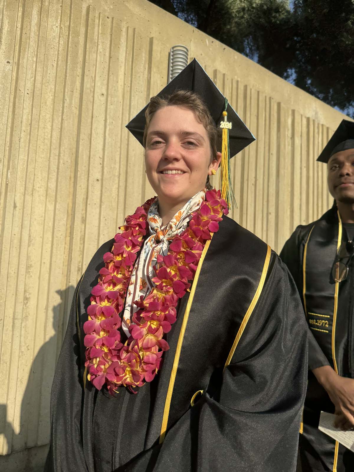Graduates walk to stage at CHC's Commencement 2024.