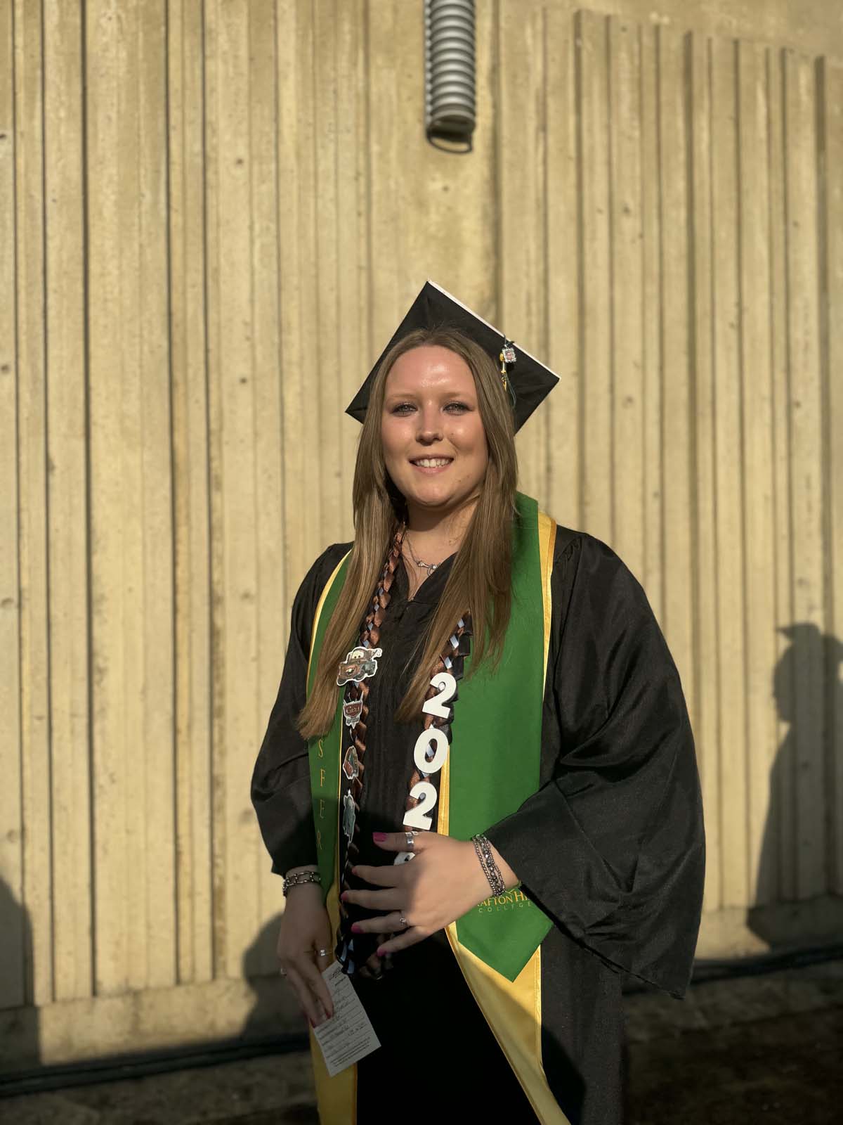 Graduates walk to stage at CHC's Commencement 2024.