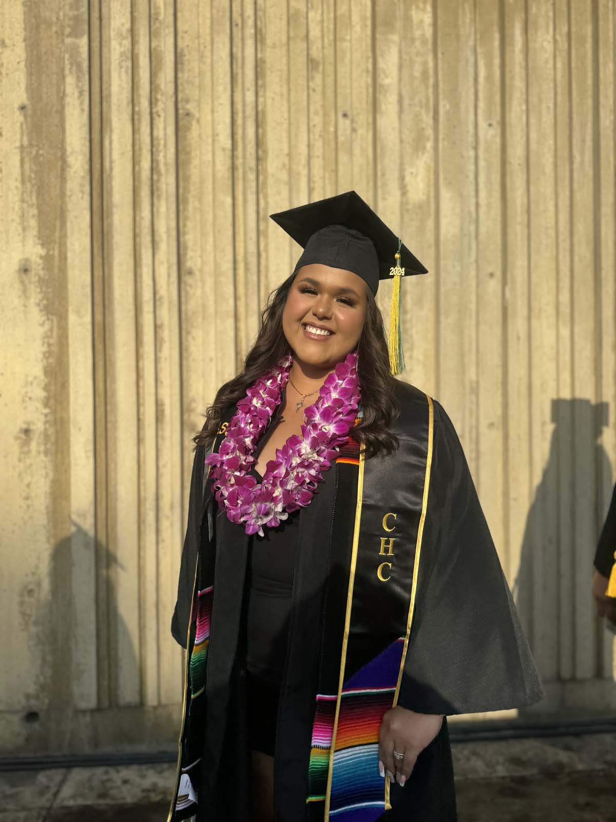 Graduates walk to stage at CHC's Commencement 2024.