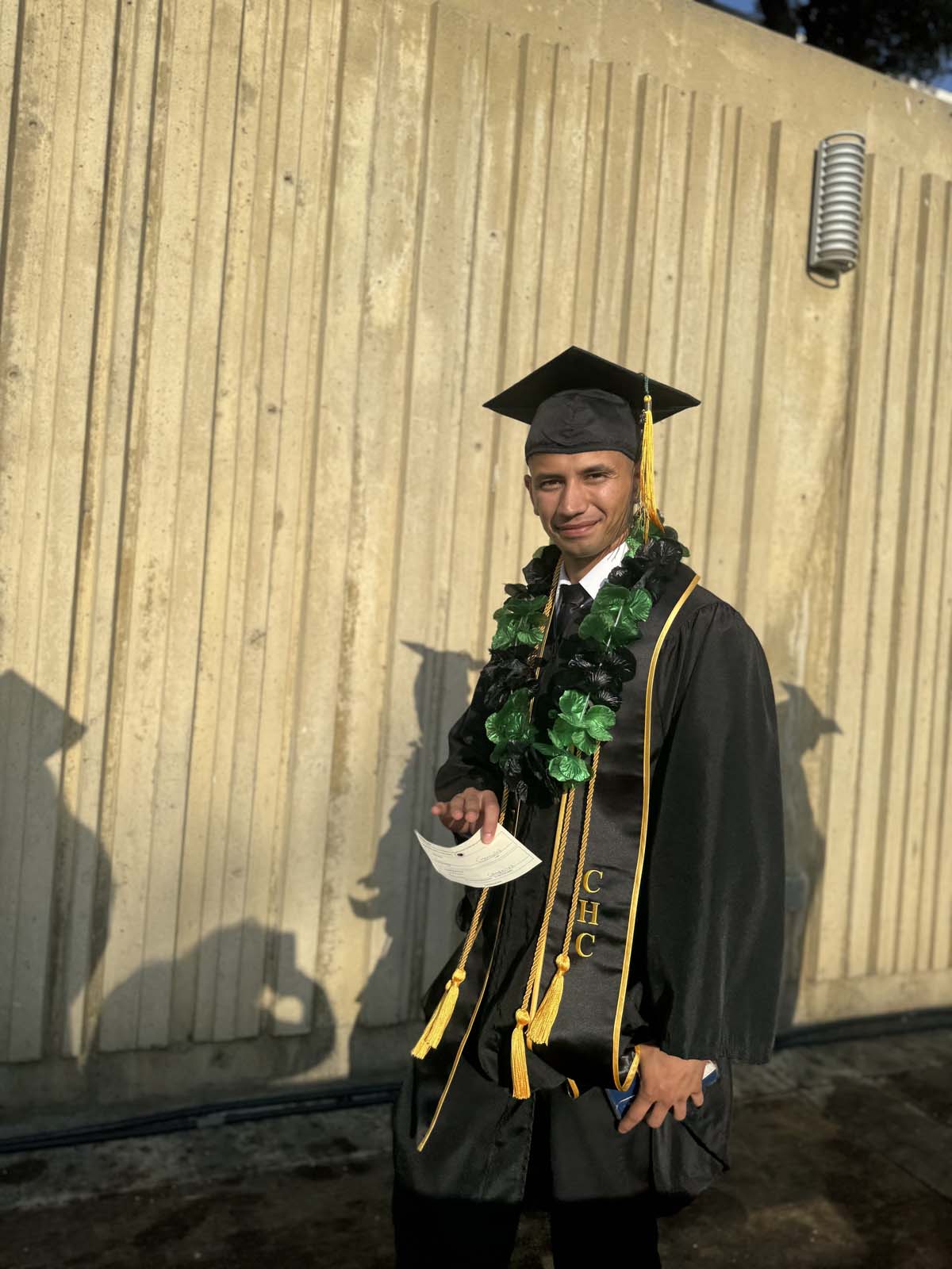 Graduates walk to stage at CHC's Commencement 2024.