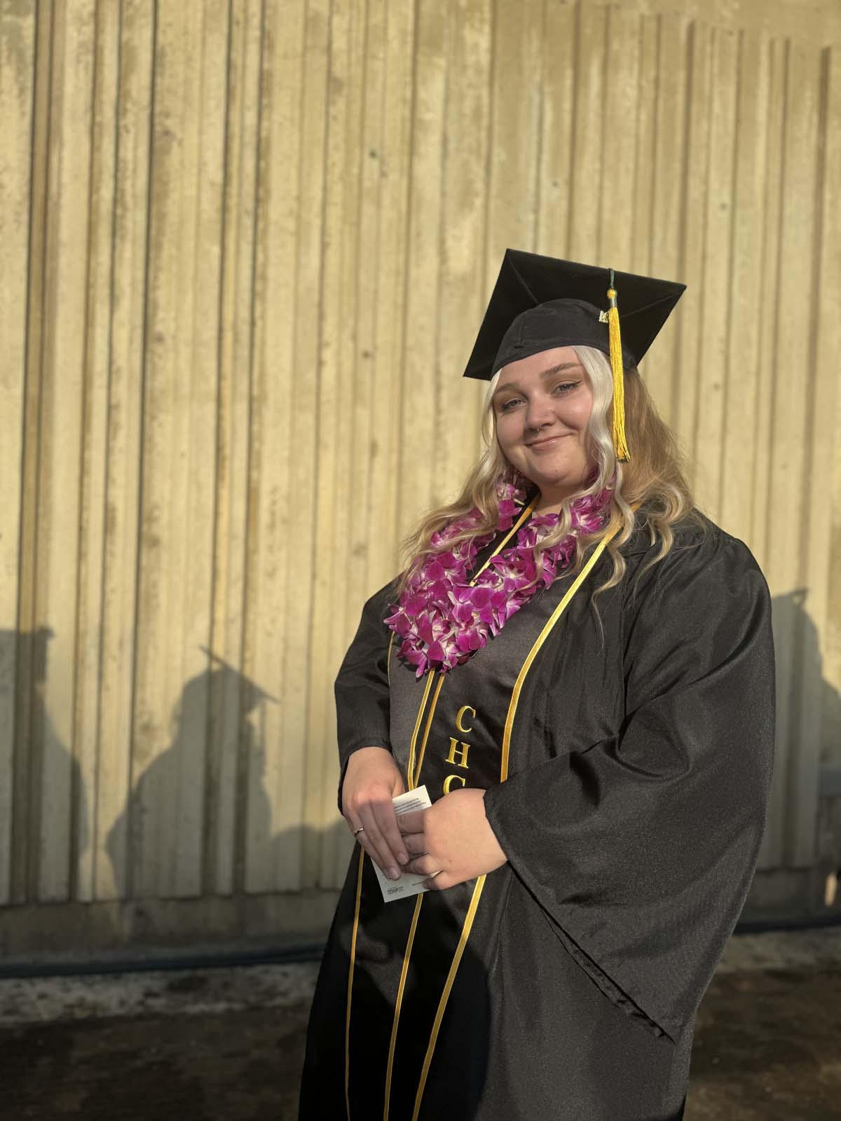 Graduates walk to stage at CHC's Commencement 2024.