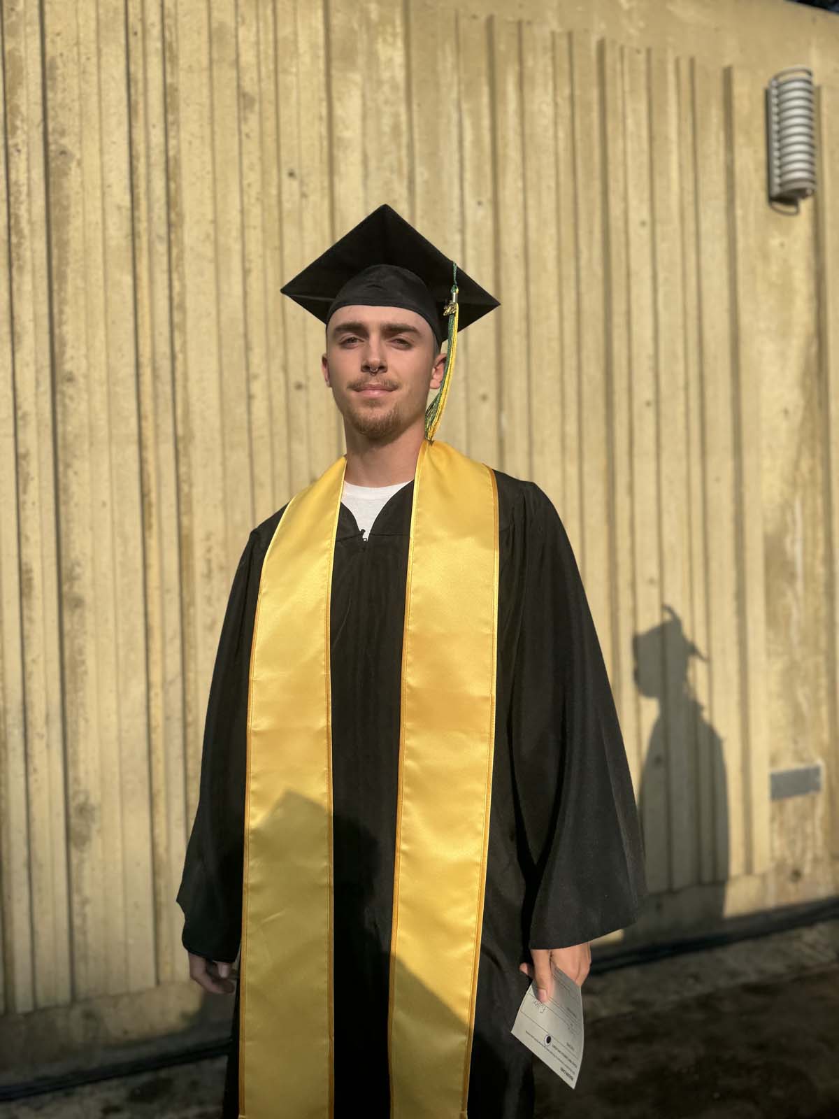 Graduates walk to stage at CHC's Commencement 2024.