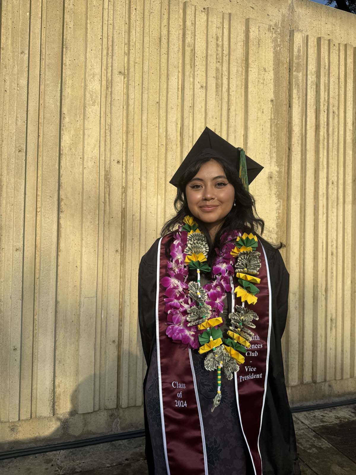 Graduates walk to stage at CHC's Commencement 2024.