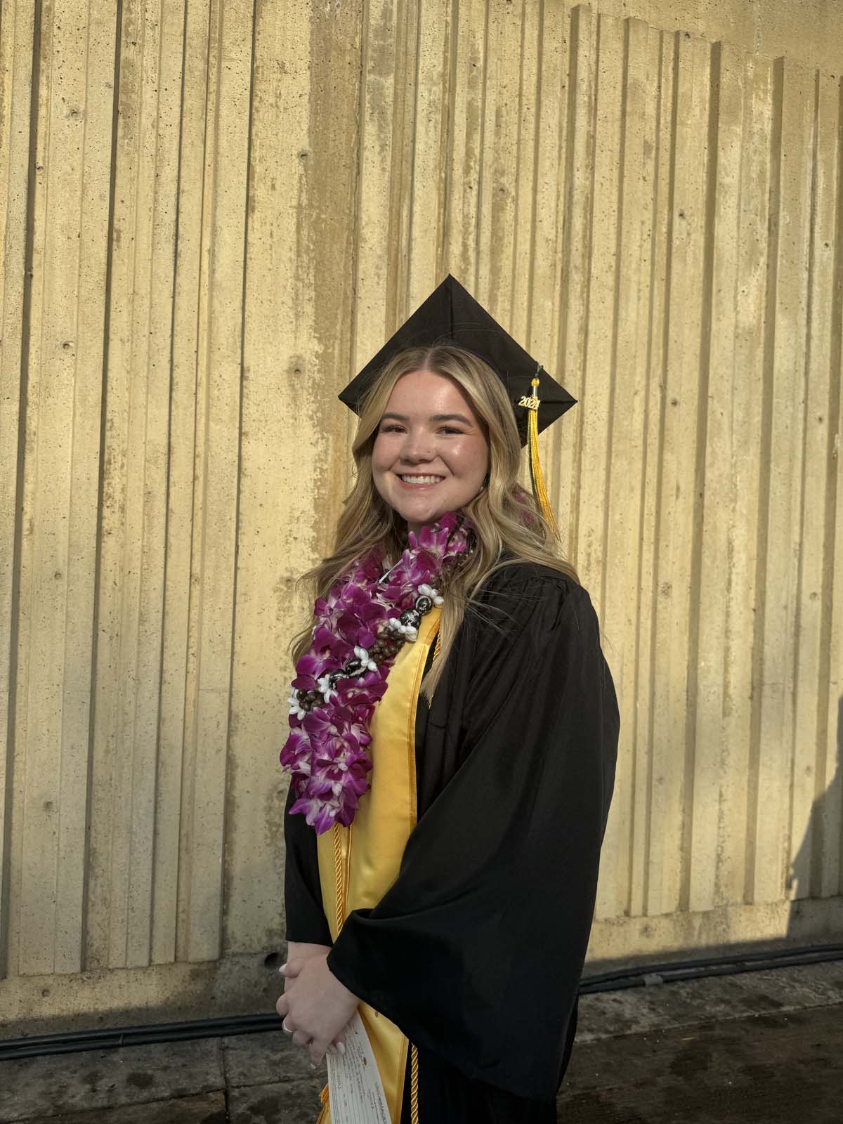 Graduates walk to stage at CHC's Commencement 2024.