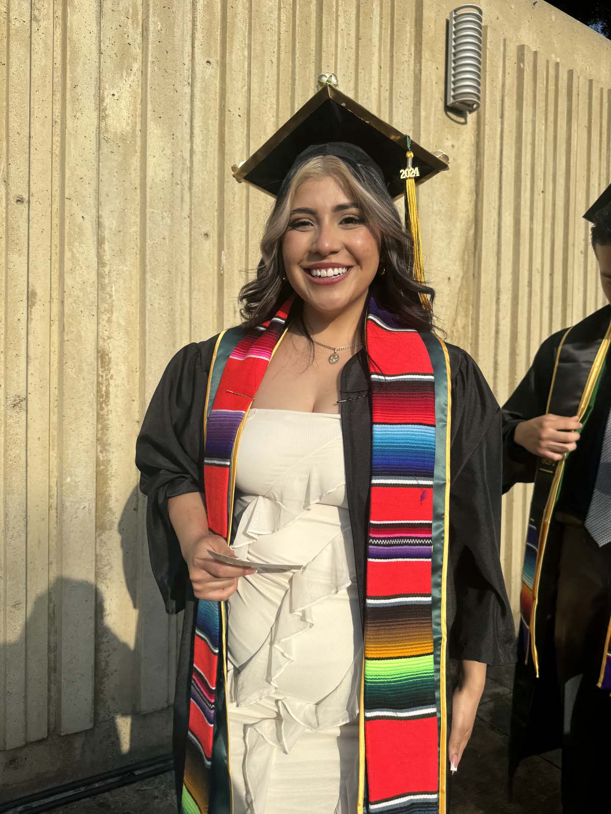 Graduates walk to stage at CHC's Commencement 2024.