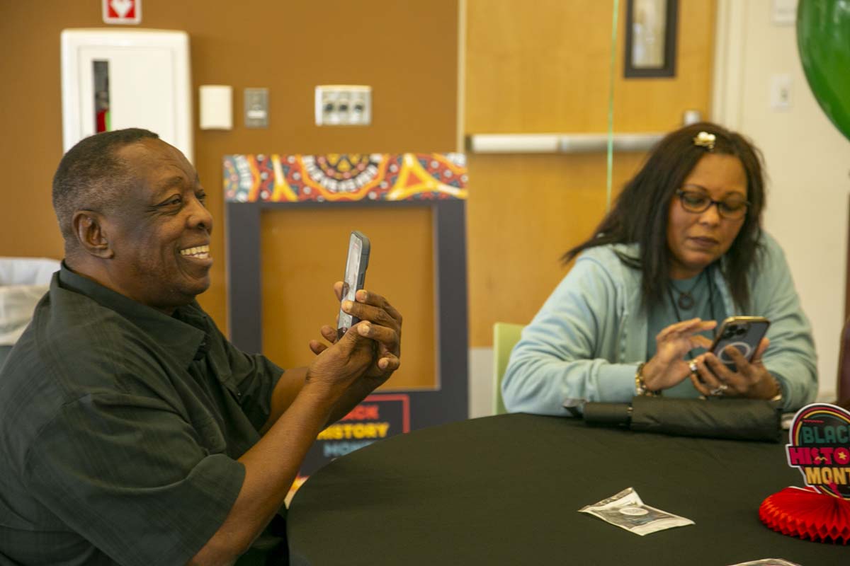 People enjoying the Black History Month closing ceremony