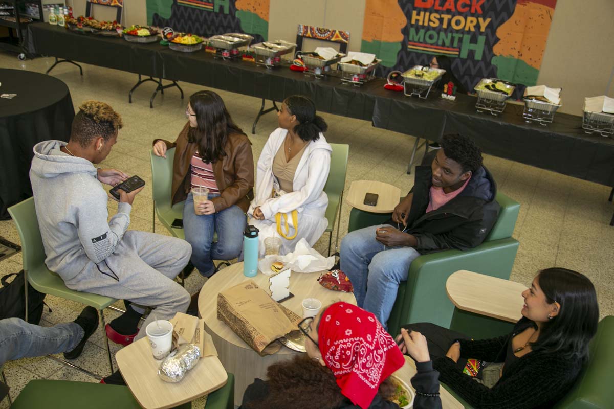 People enjoying the Black History Month closing ceremony