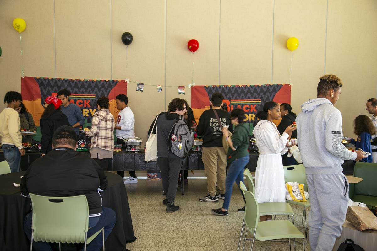 People enjoying the Black History Month closing ceremony