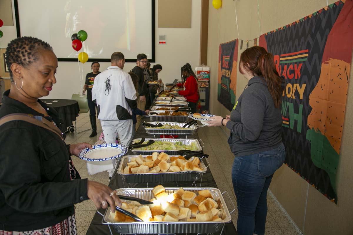 People enjoying the Black History Month closing ceremony