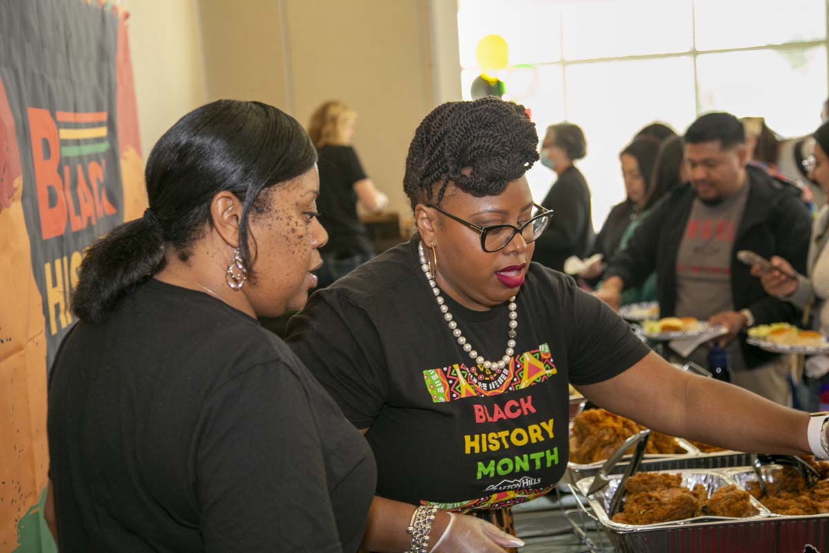 People enjoying the Black History Month closing ceremony