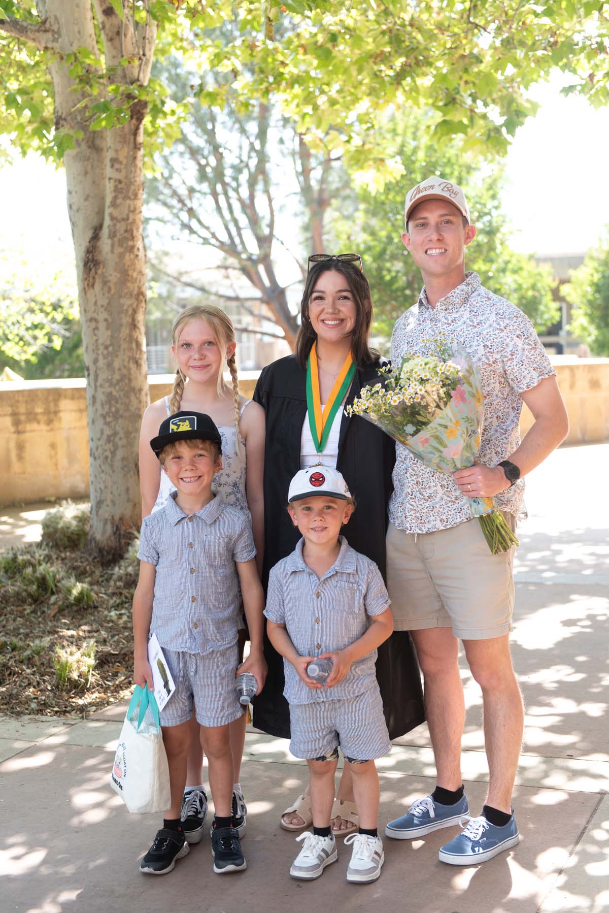 Grad recession at Commencement 2025 and pictures with family members.