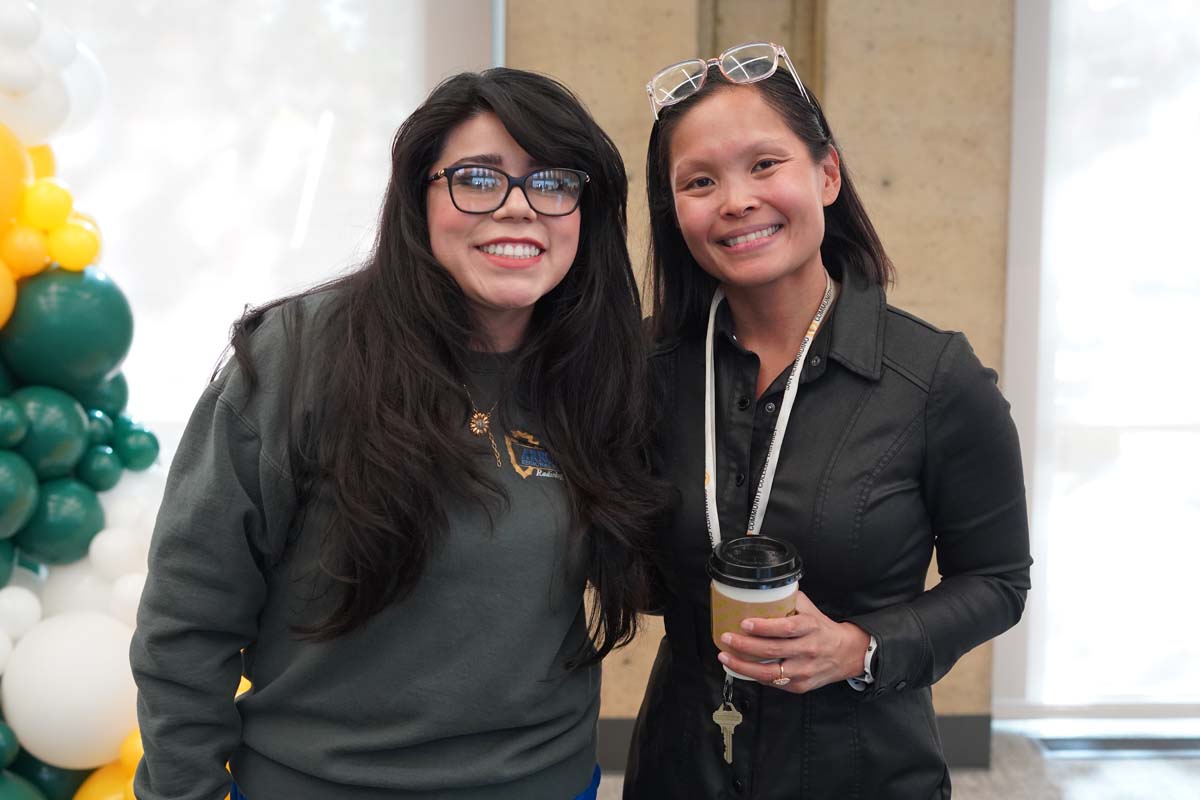 Two people posing for photo