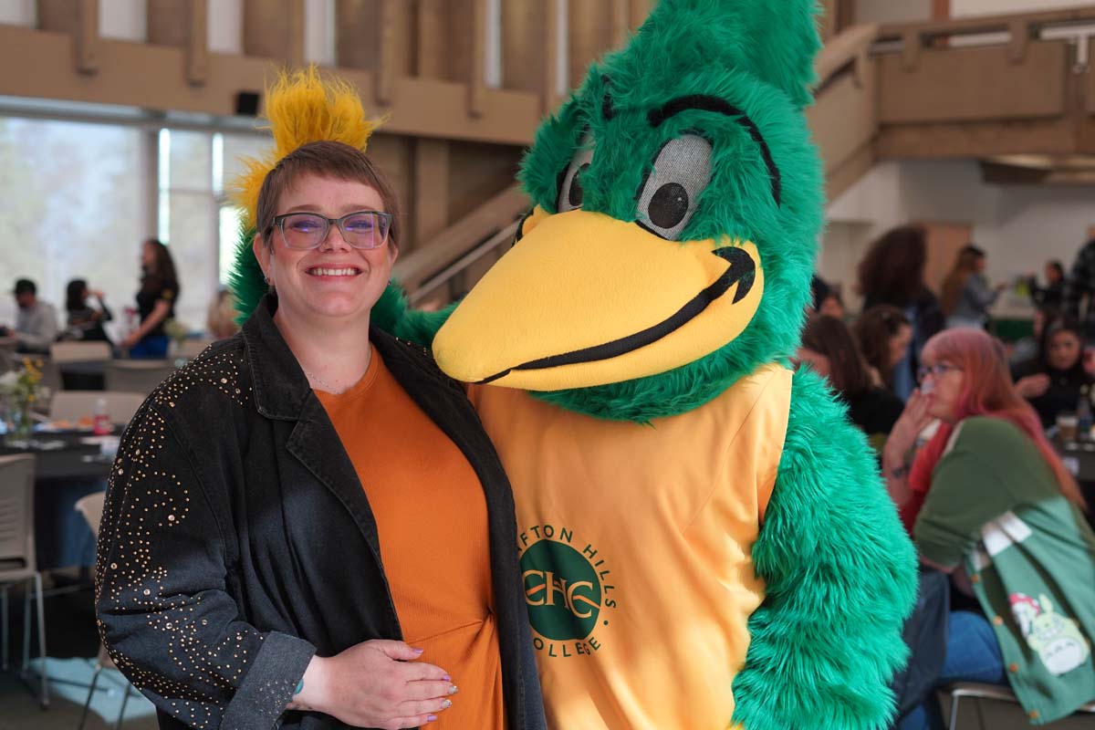 Student taking a photo with Ryker