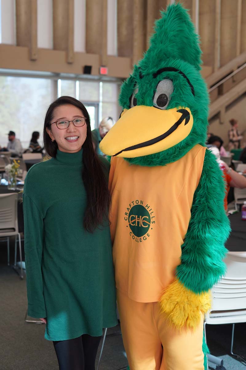 Student taking a photo with Ryker