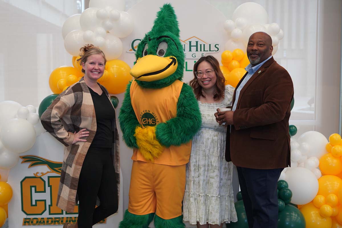 Three people posing with Ryker