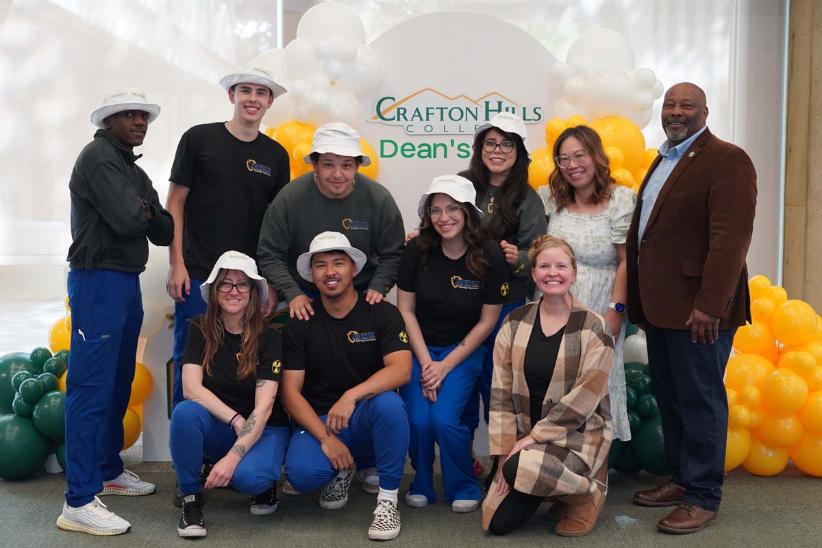 Group in front of the event backdrop