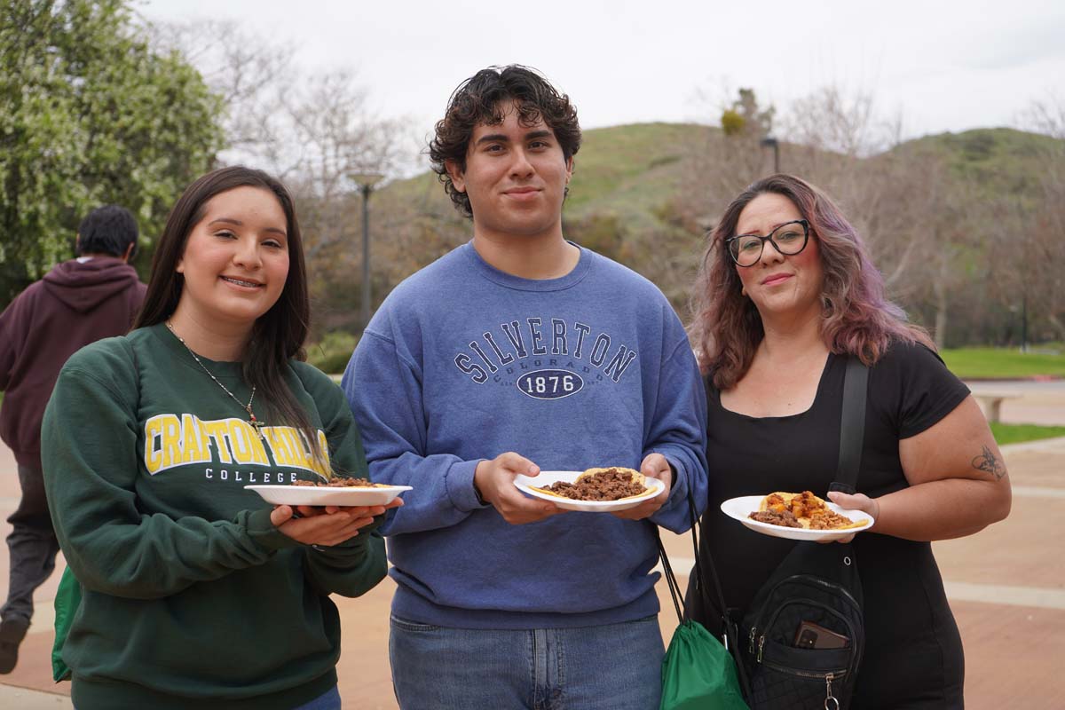 Students posing for a picture with food