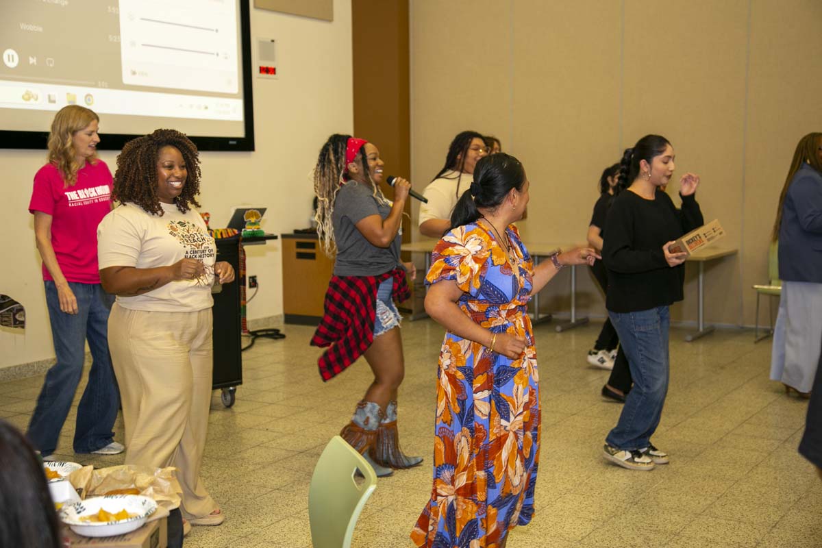 Group line dancing after speaker