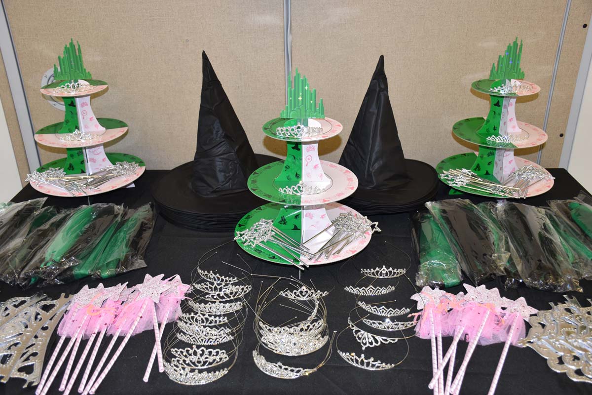 Four students in front of the backdrop