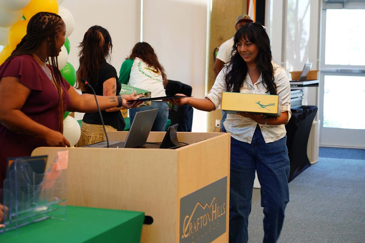 EOPS Scholar receiving certificate