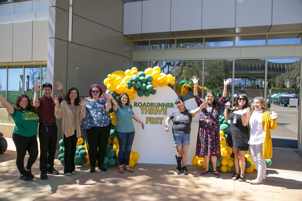 Thrive Fest organizers with THRIVE sign