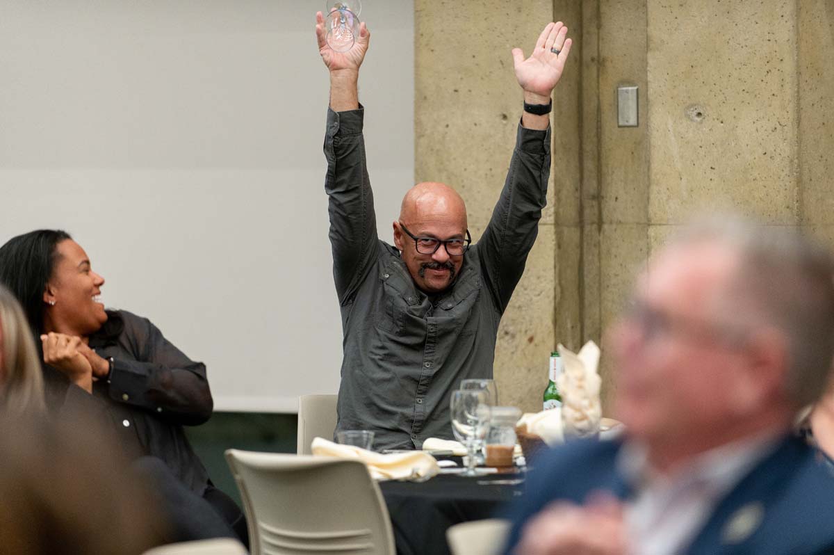 President's Circle Magic Night person with their hands up