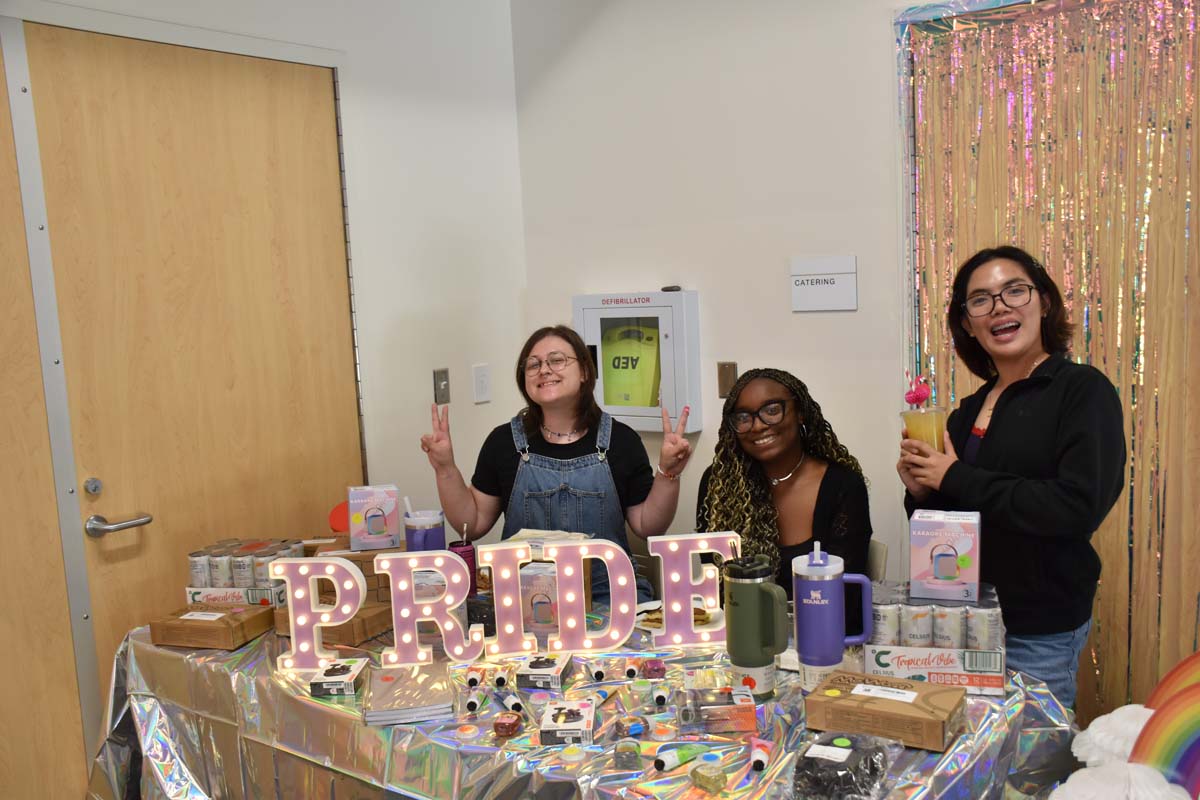 Three students at the prize table