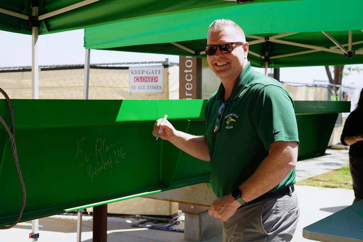 President Horan signing the beam