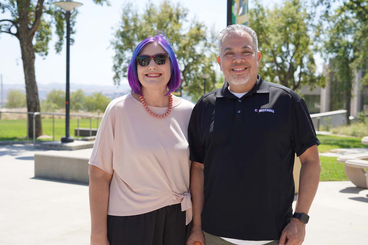 Two people posing at the event