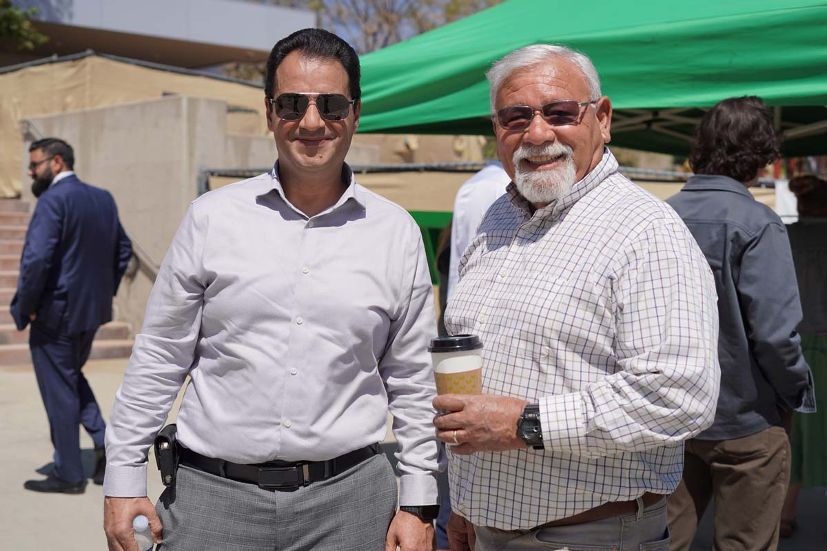 Two people posing at the event