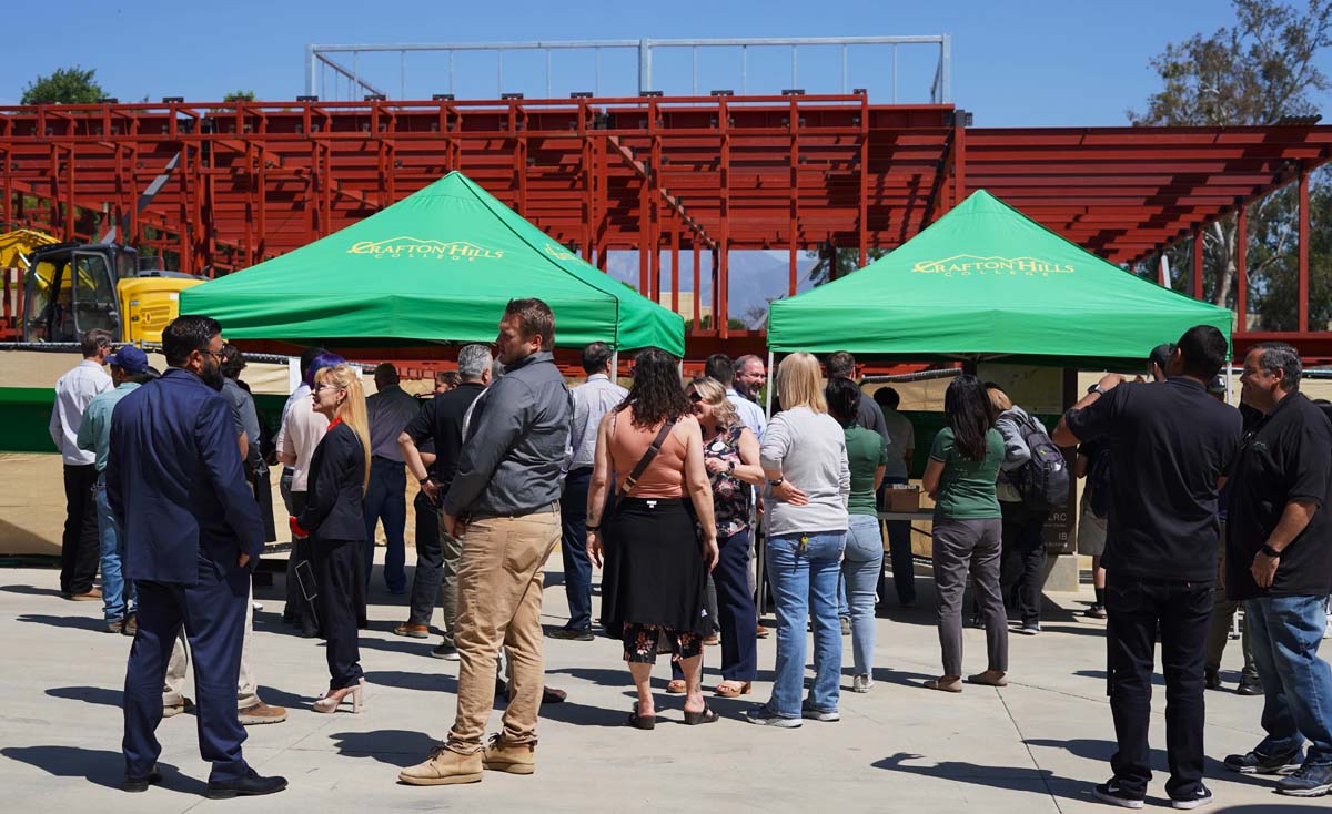 People waiting in line to sign the beam