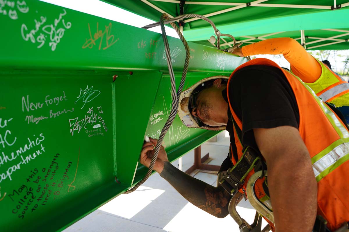 Construction partner signing the beam