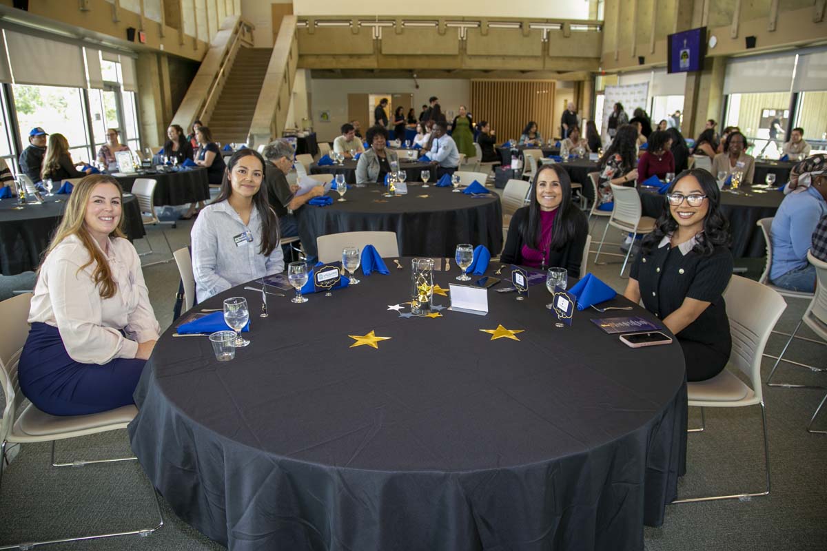Etiquette Luncheon table with 4 students