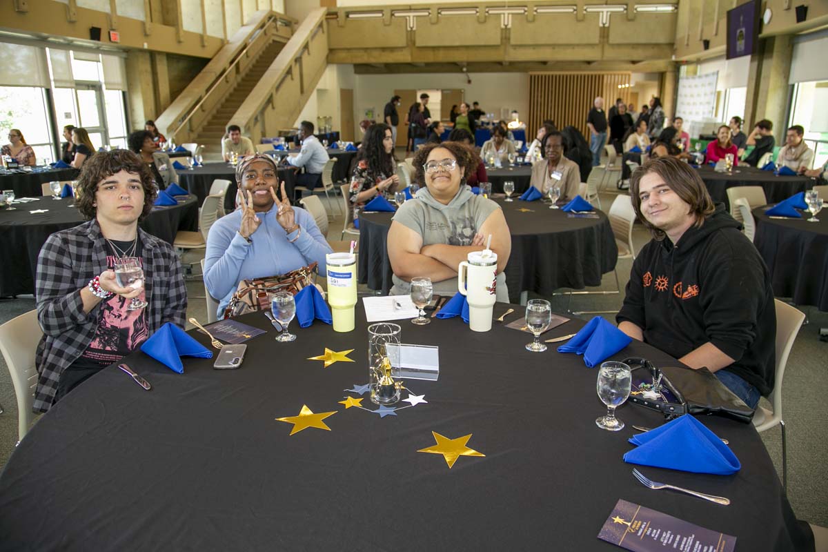 Etiquette Luncheon table with 4 students