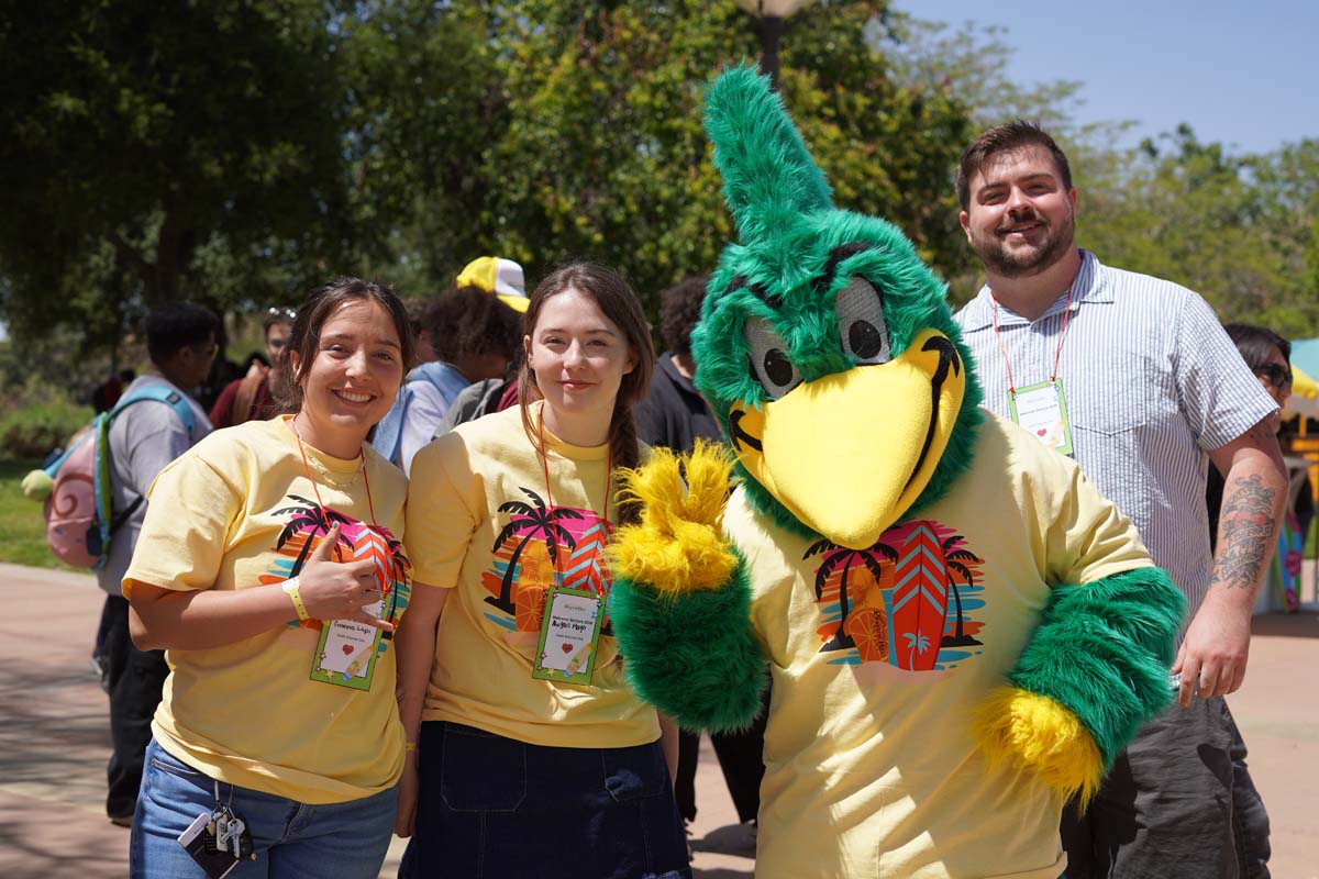 Students taking a photo with Ryker