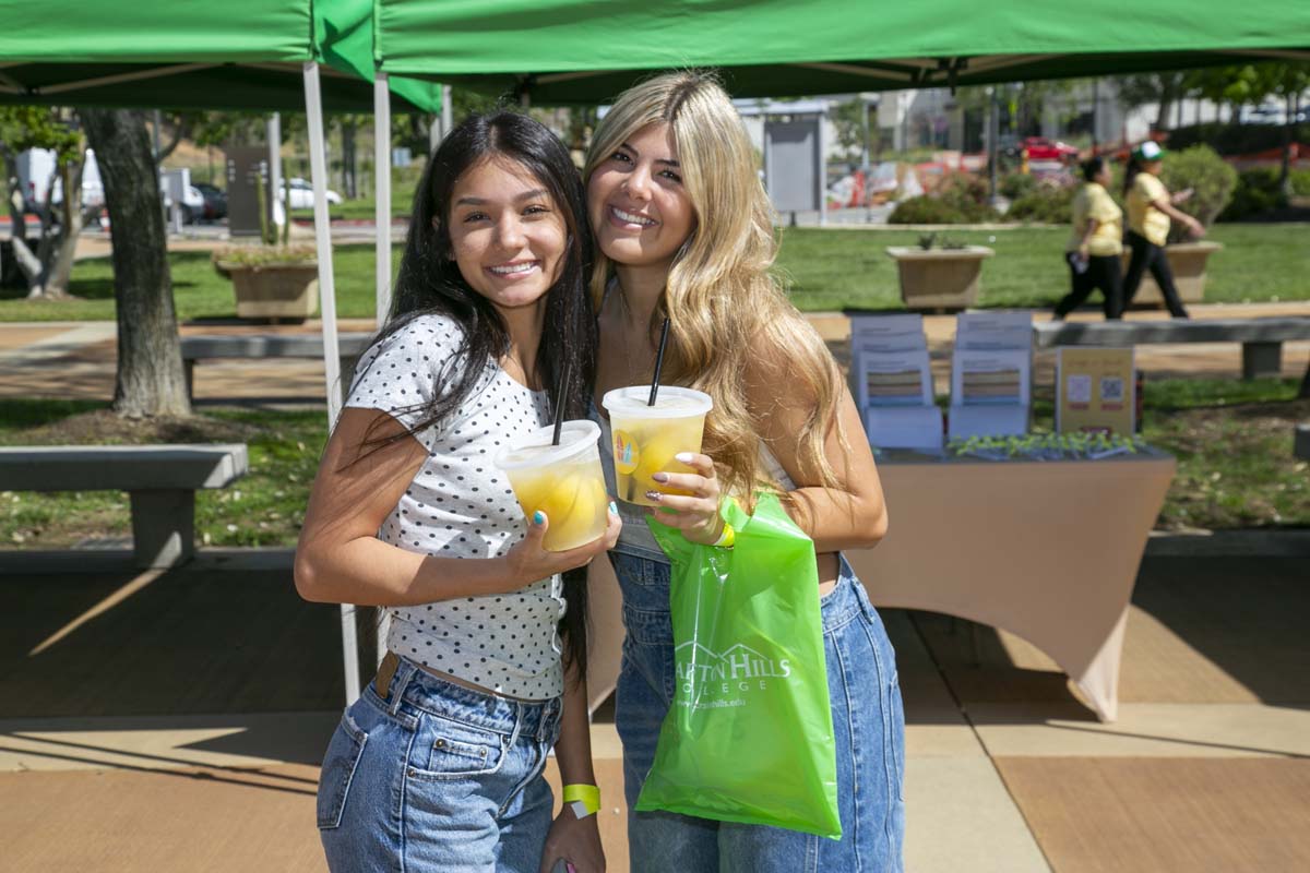 Two students posing with their lemonade