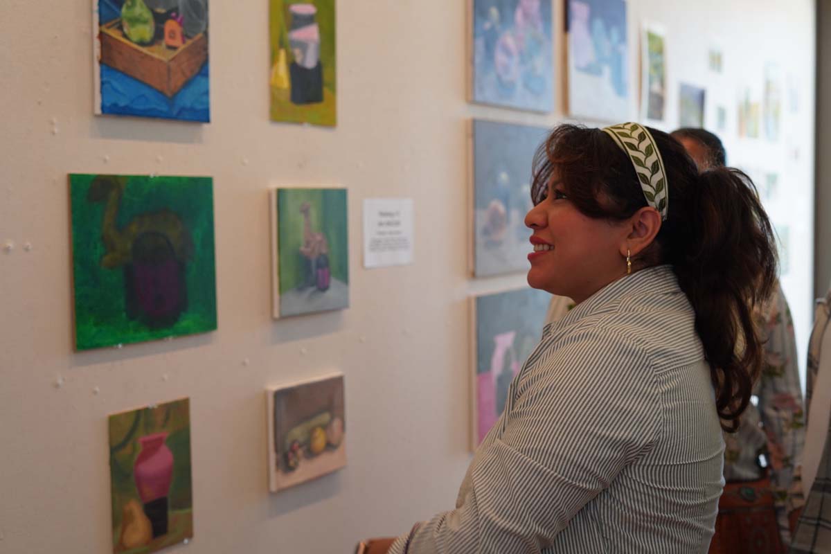 Student looking at art