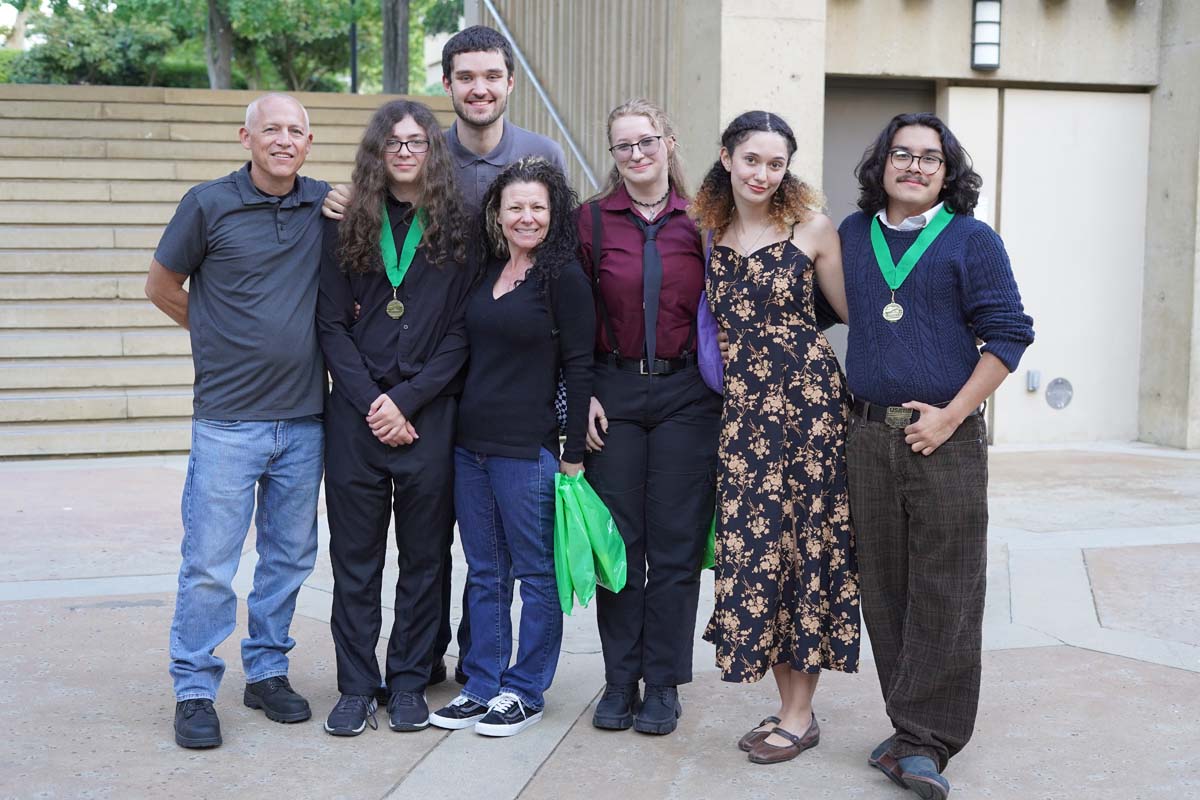 Family posing with their grads