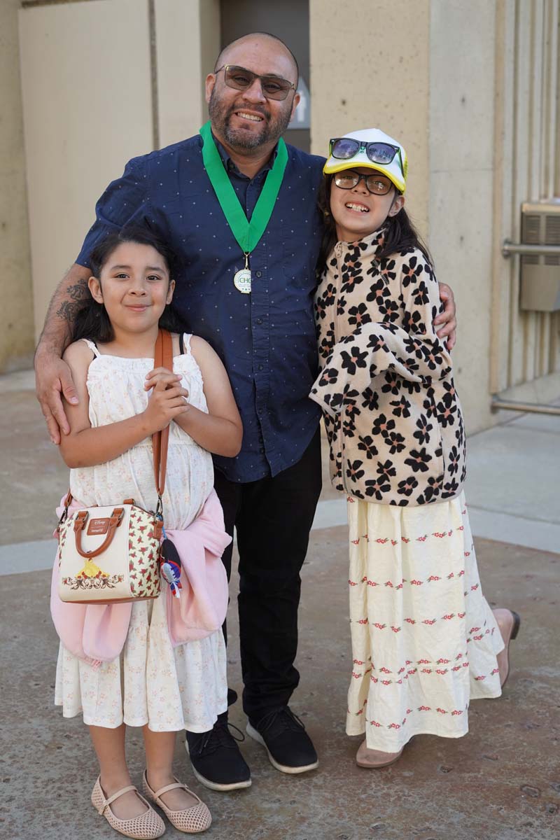 Family posing with their grads