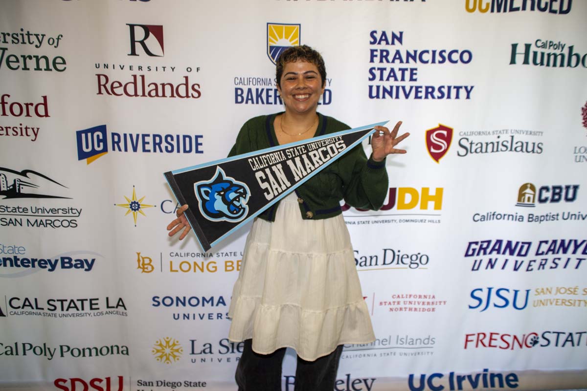 Student with CSU San Marcos transfer flag