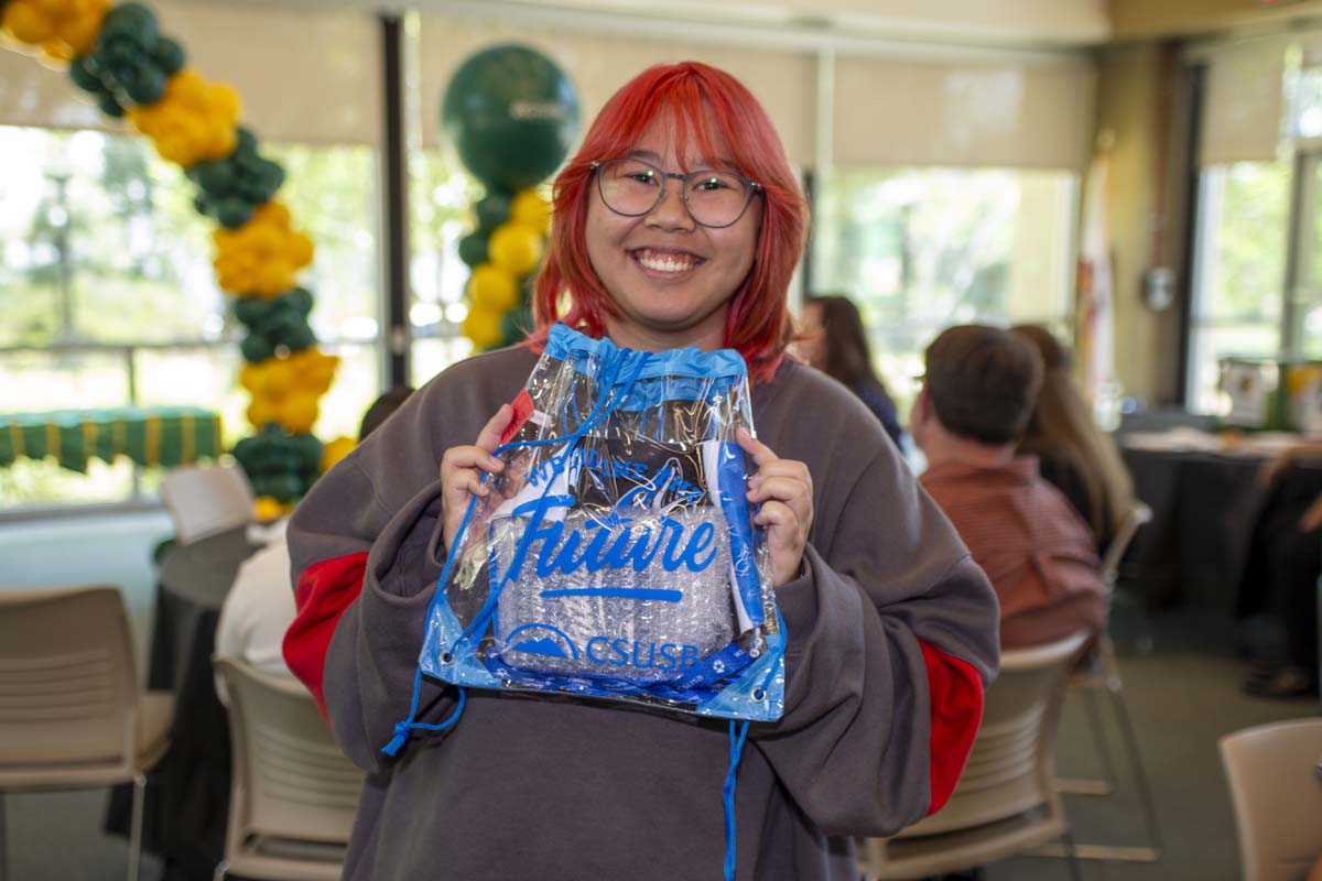 Student with CSUSB swag bag