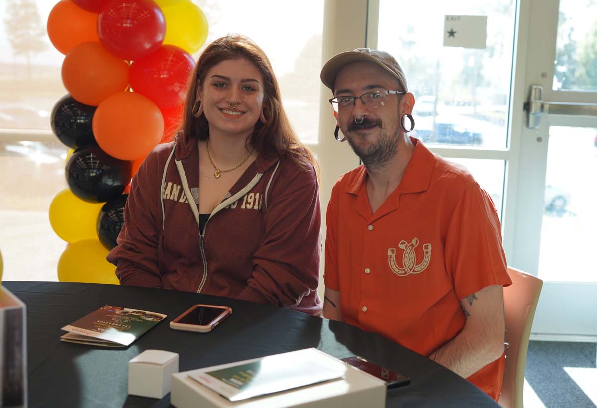 Two MESA students at a table