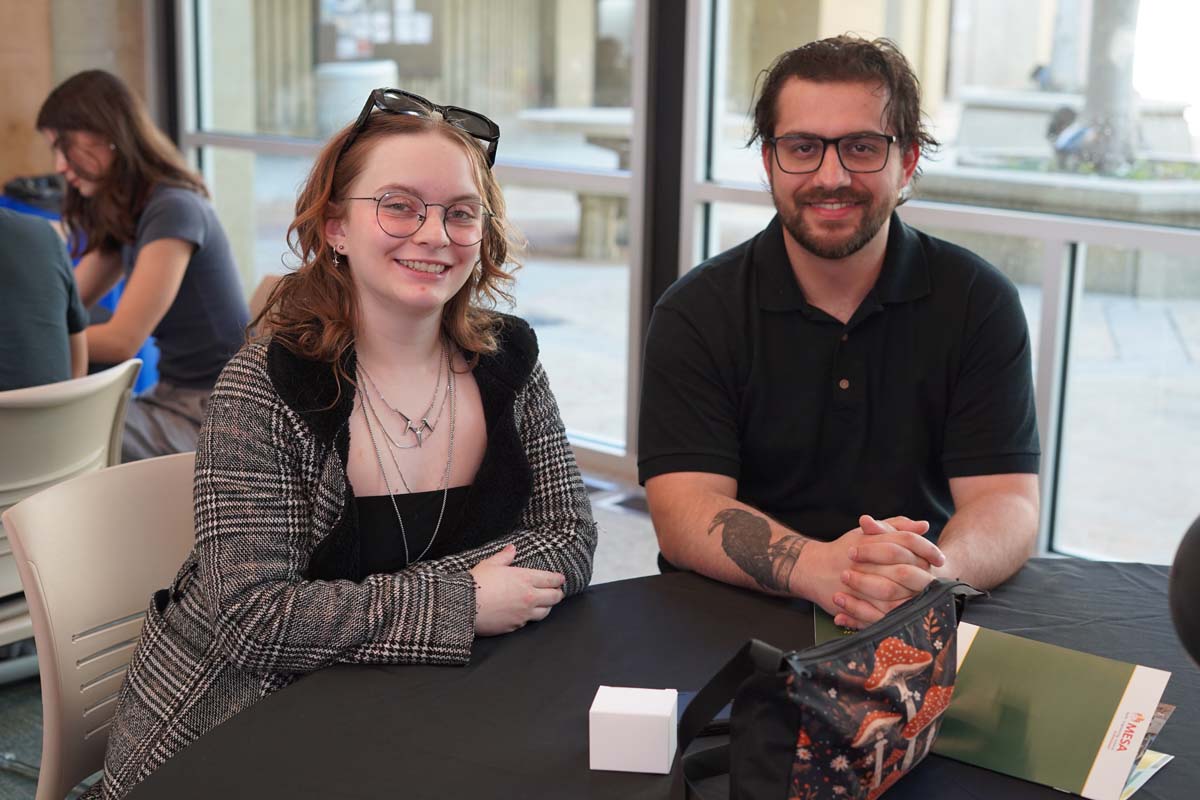 Two MESA students at a table