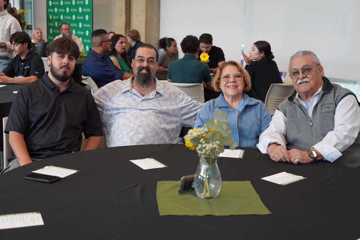 Four people sitting at a table