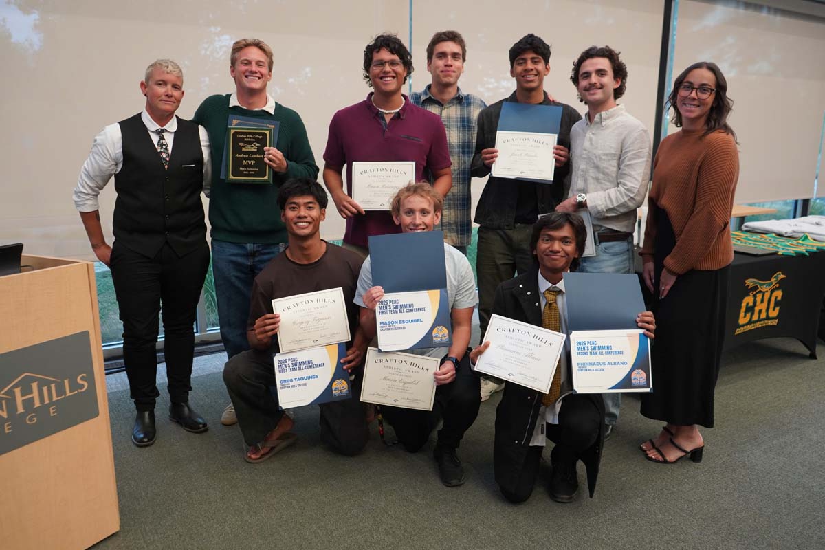 Team standing with certificates
