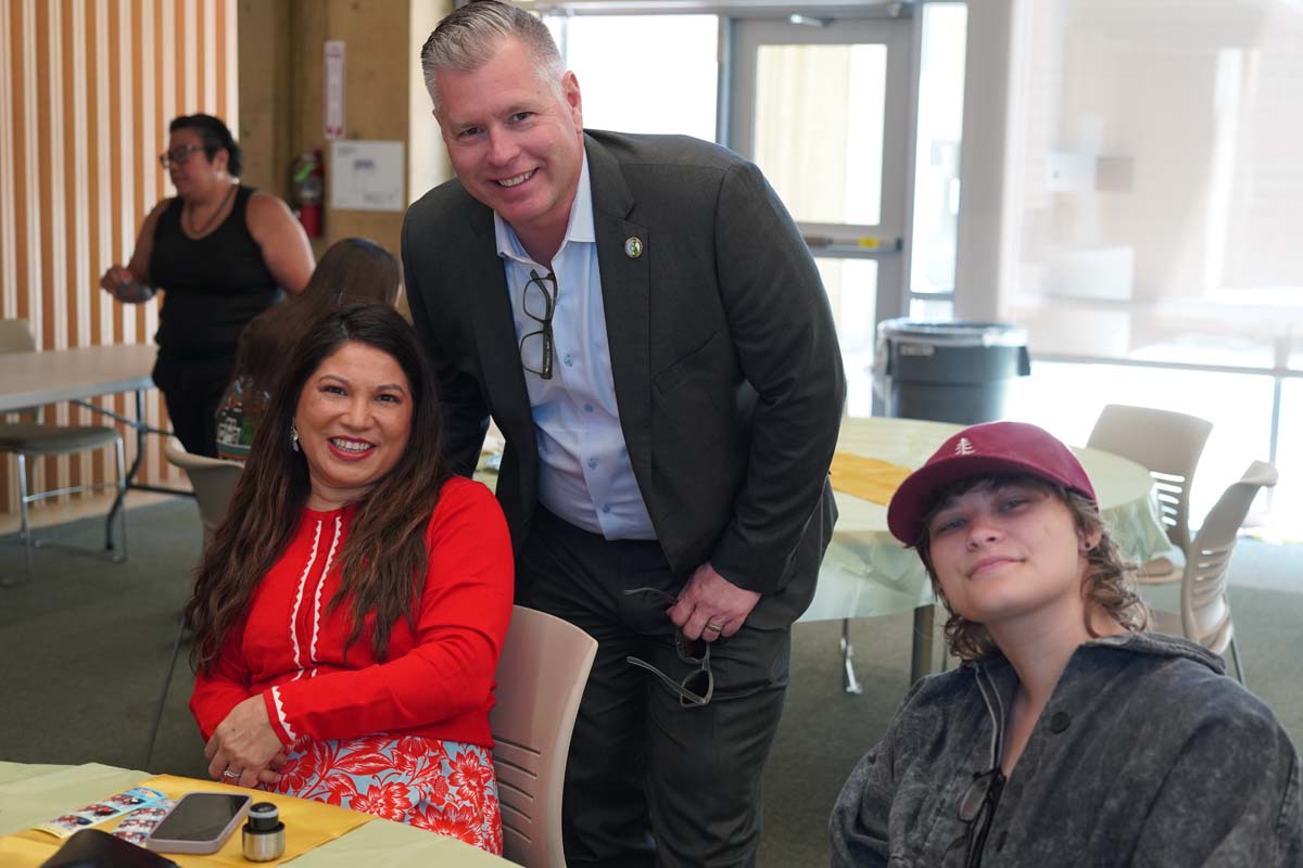 President Horan posing with staff and students