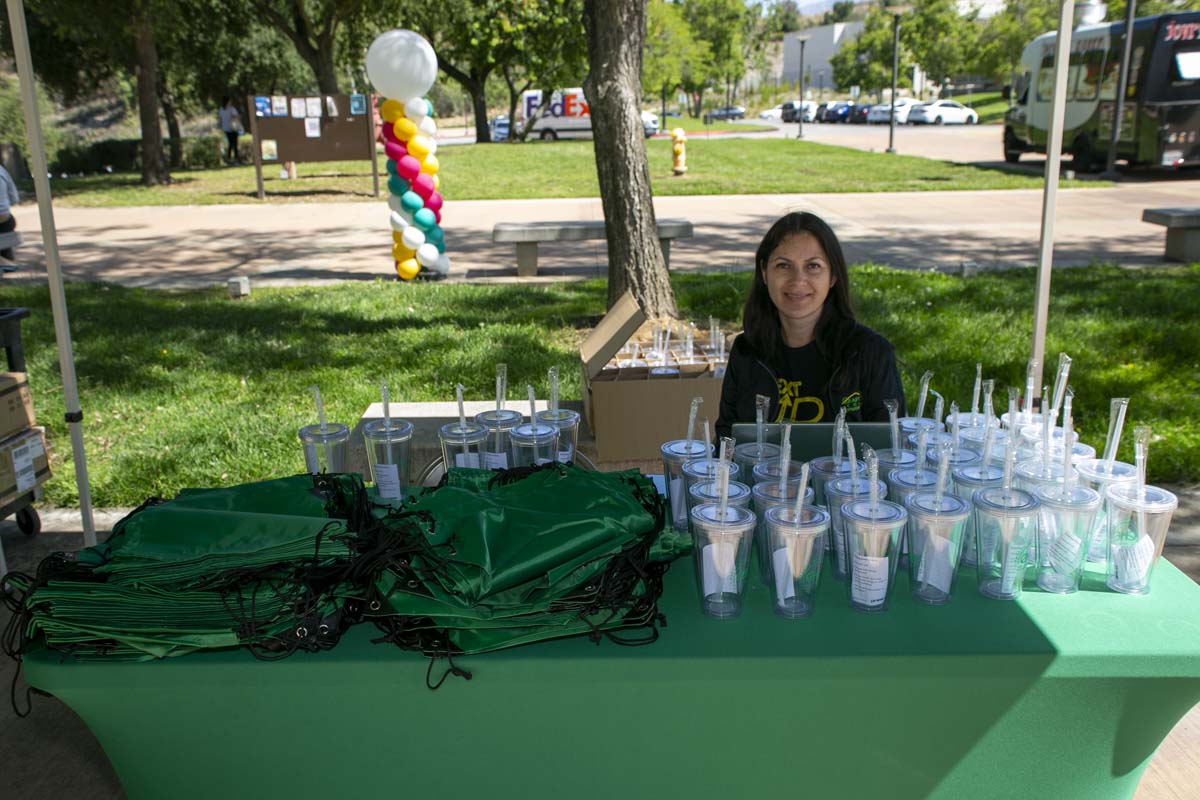 EOPS staff at booth with water bottles and bags