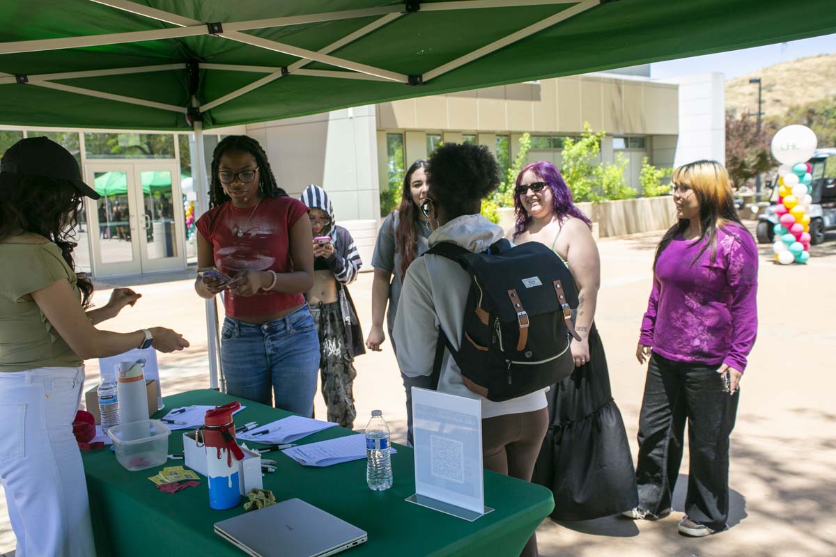 Students lined up at sign-in table