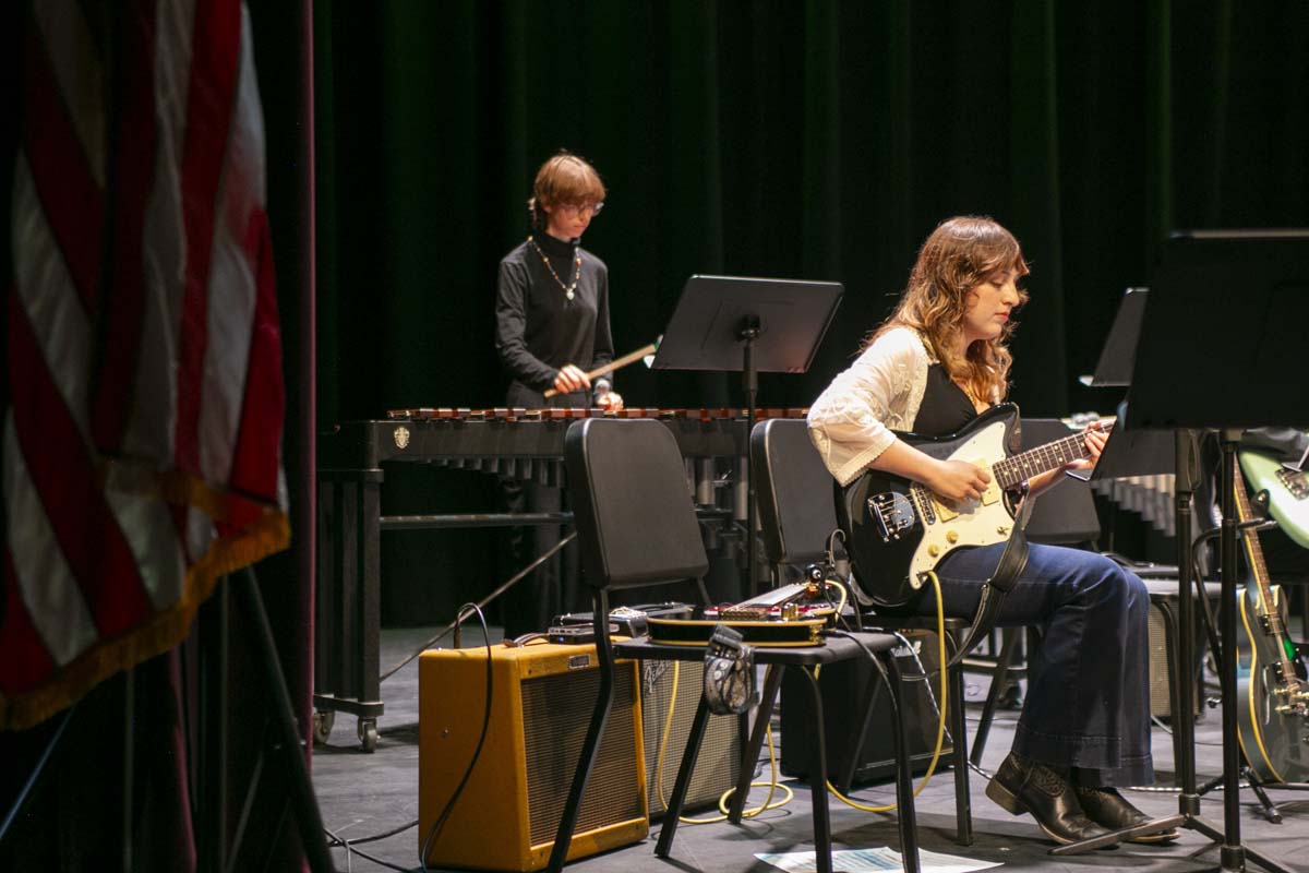 Student playing guitar at jazz concert