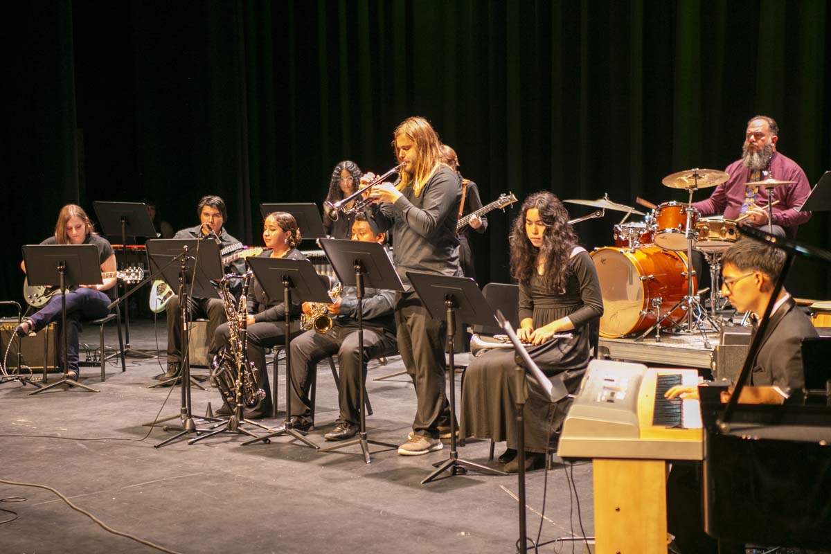 Student playing brass instruments at jazz concert